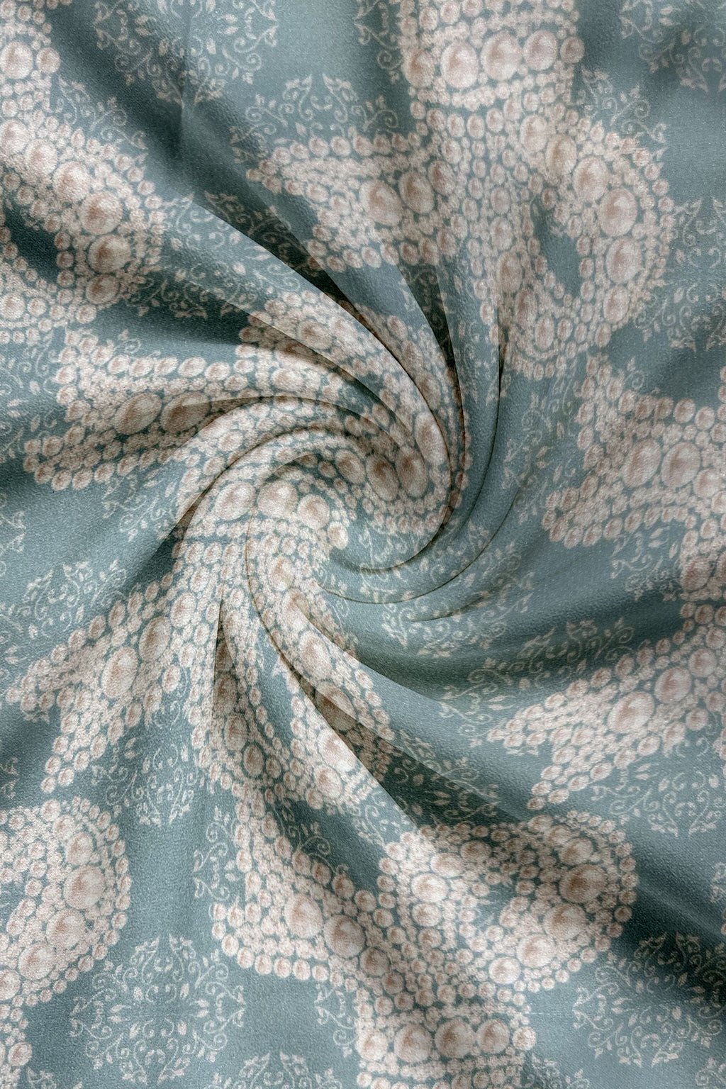 Mukhawar Fabric with a floral pattern on a blue background
